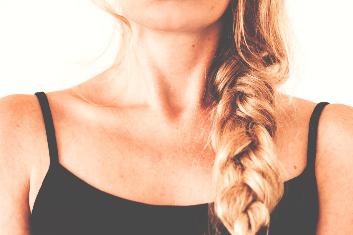 blonde woman zoomed in on bottom of jaws to shoulders